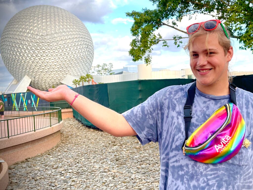 Ethan holding up the globe at EPCOT